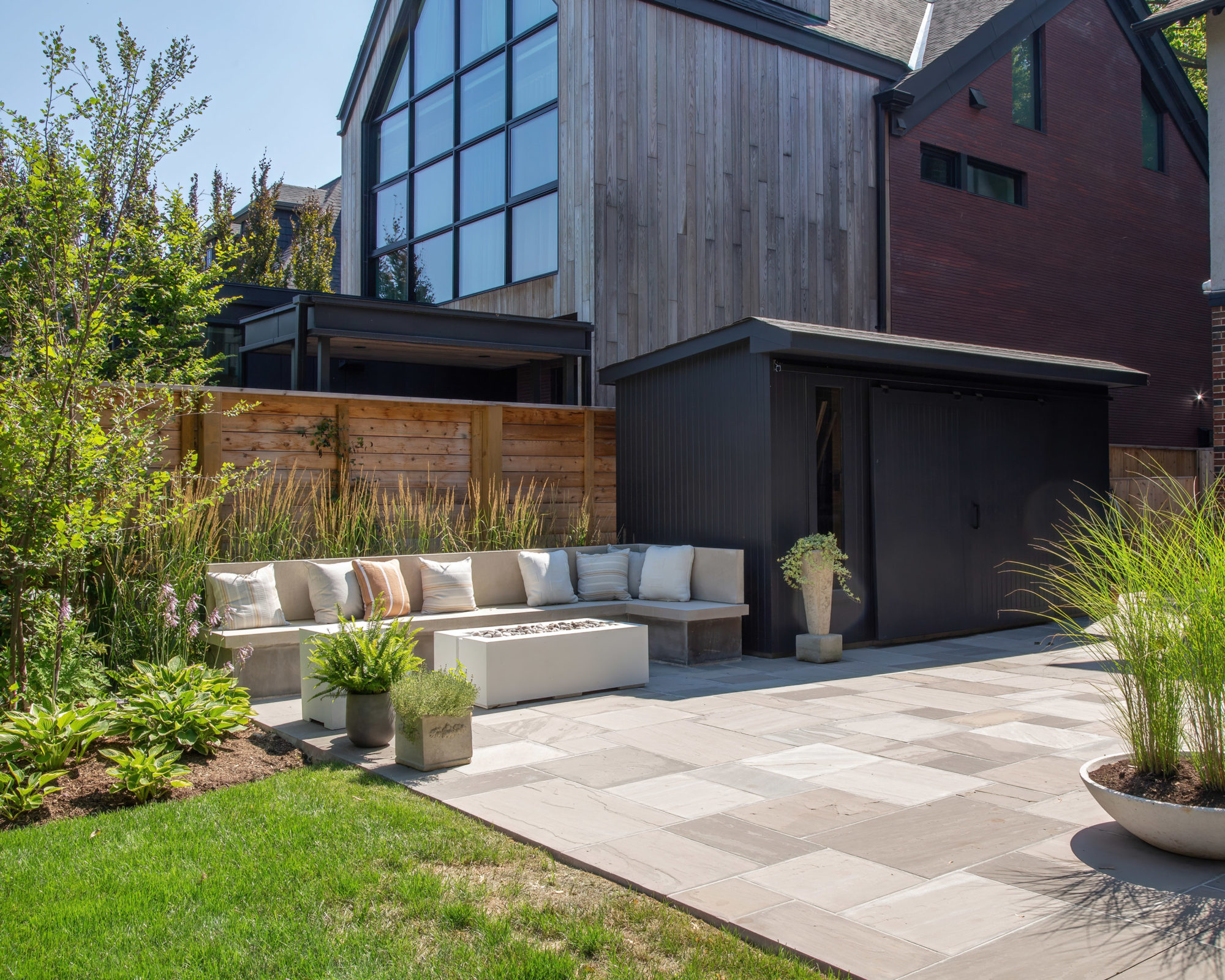 The new backyard: a water fountain, stone seating and a crisp patio. 