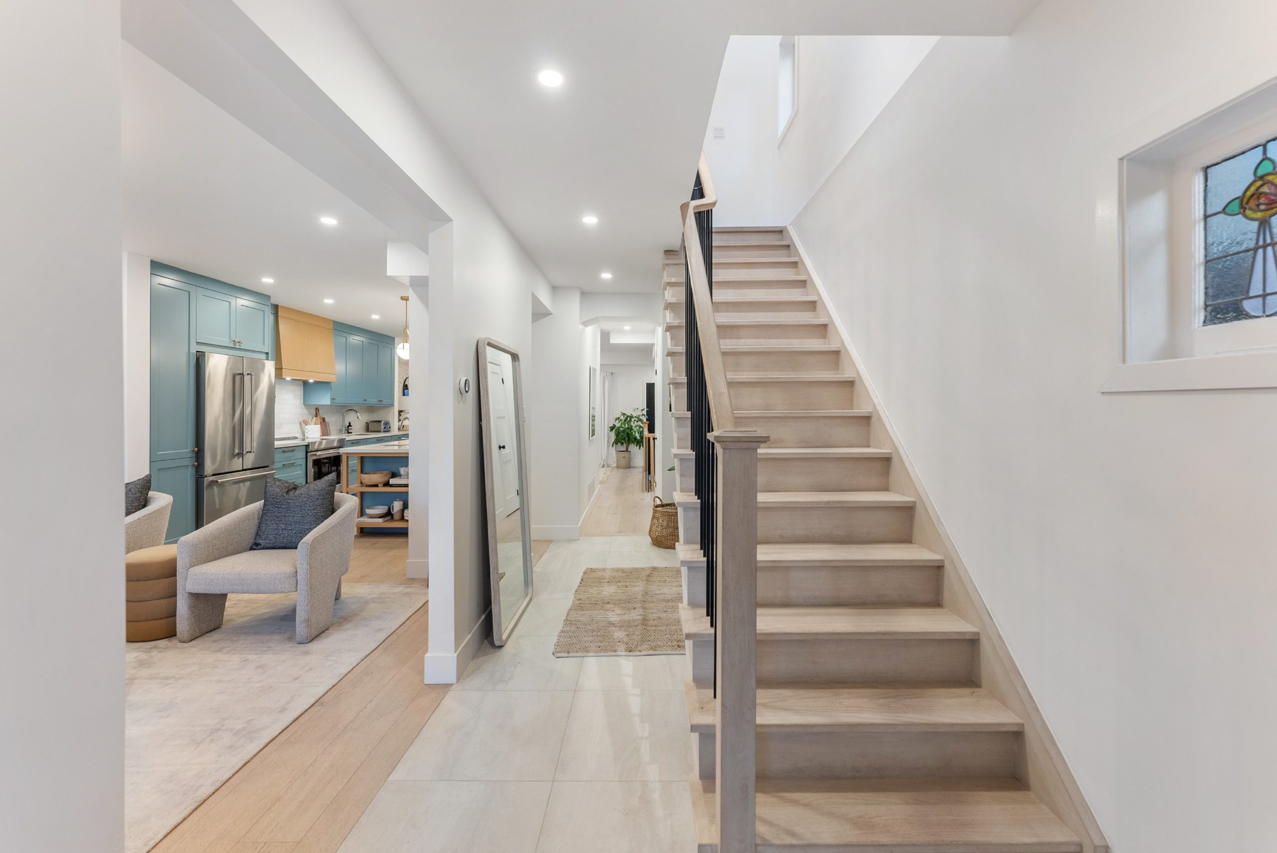 Modern open concept on the left side of the home, traditional alley-style layout on the right. 