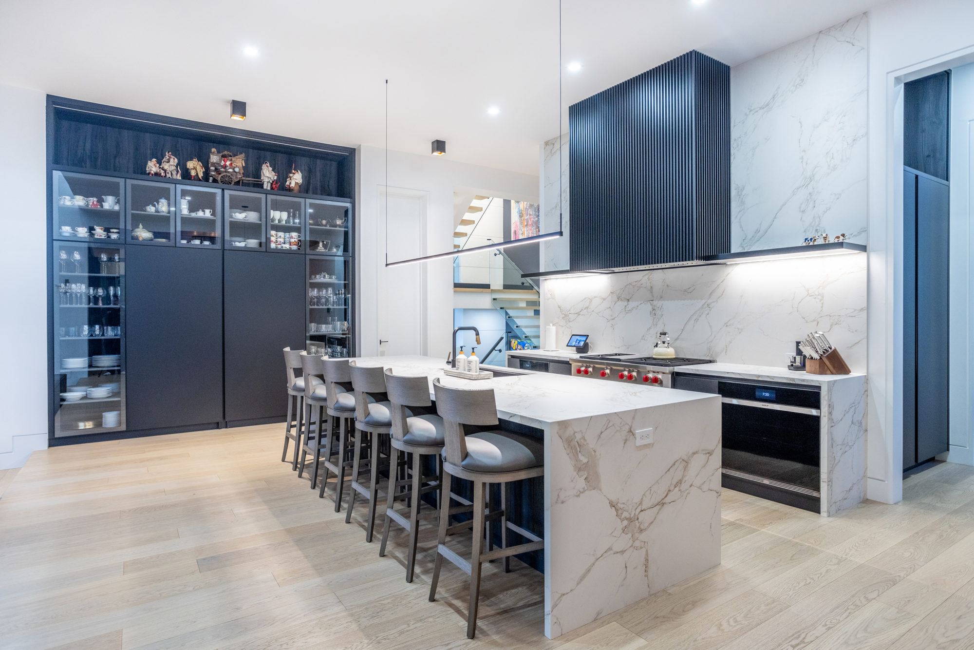 That feature wall on the left conceals a second kitchen. 