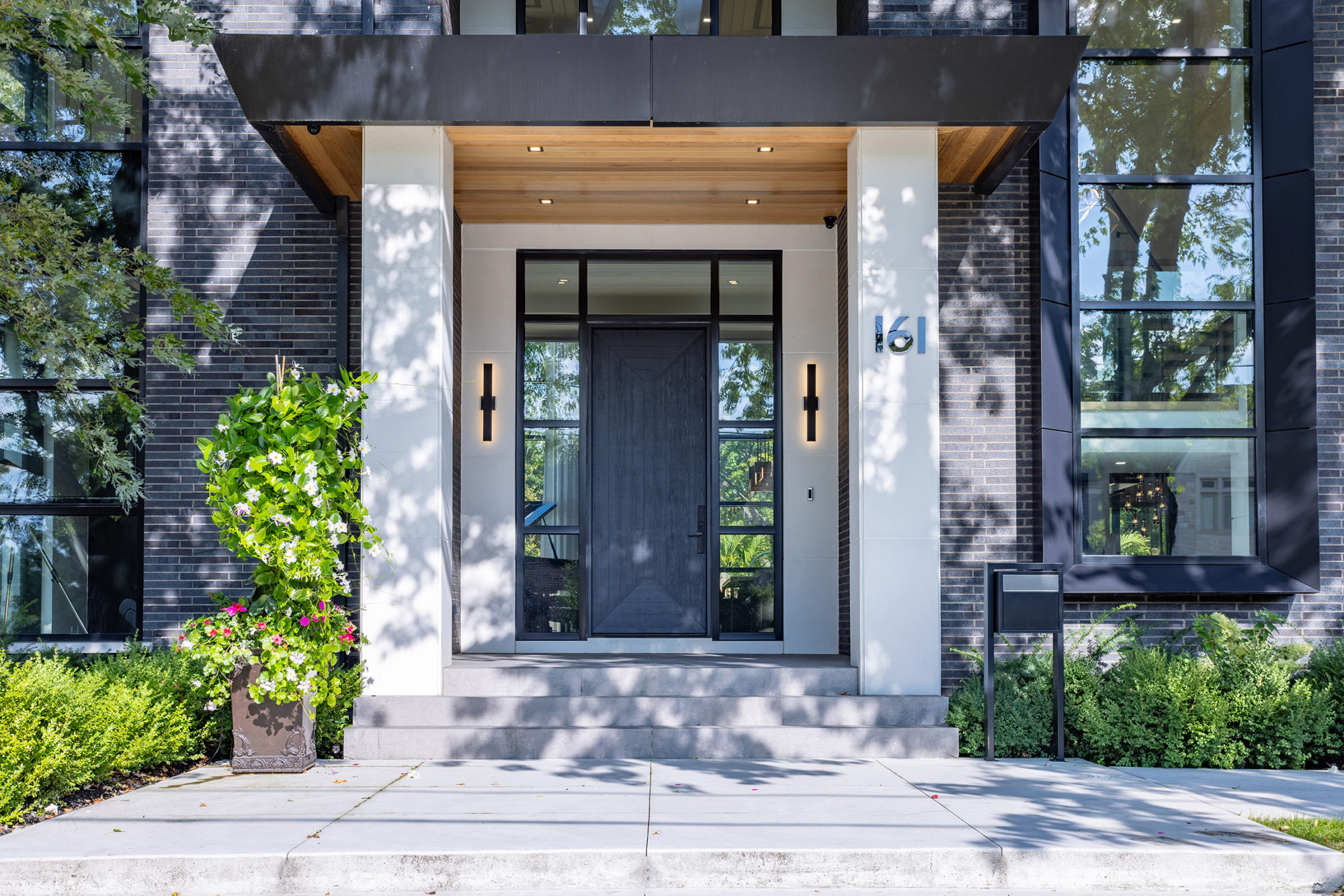 The warm, hardwood soffits relive the otherwise austere exterior. 