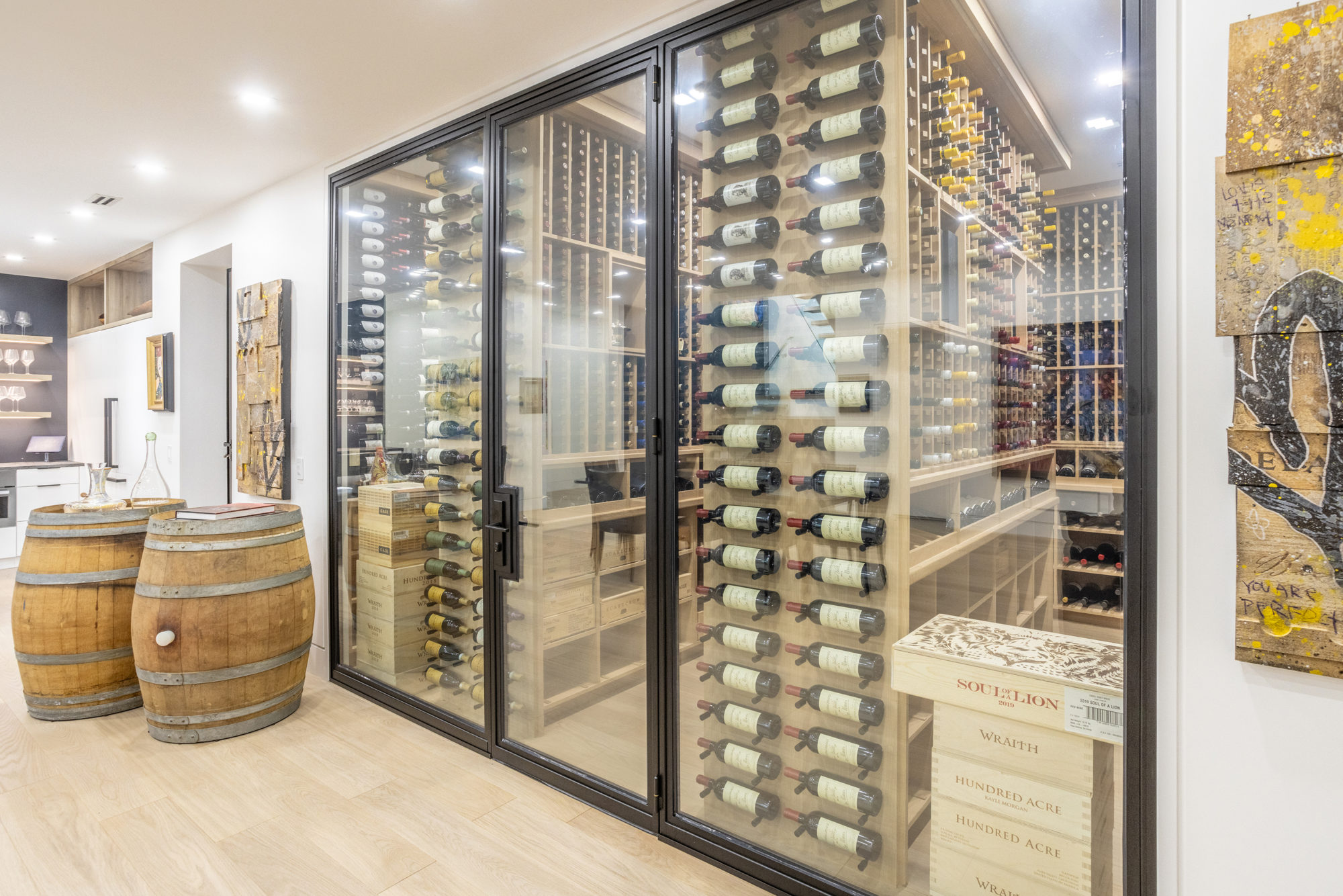 The 5,000-bottle wine cellar comes with custom app for looking up varieties. 