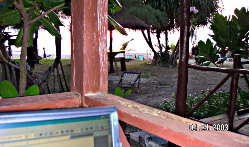 Using public Wi-Fi on a laptop on a beach hut in Ko Lanta Thailand