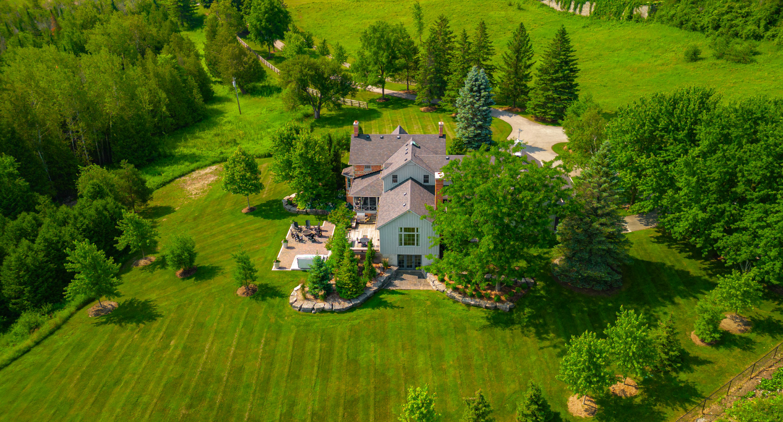 The property sits on 12 acres of verdant land. 