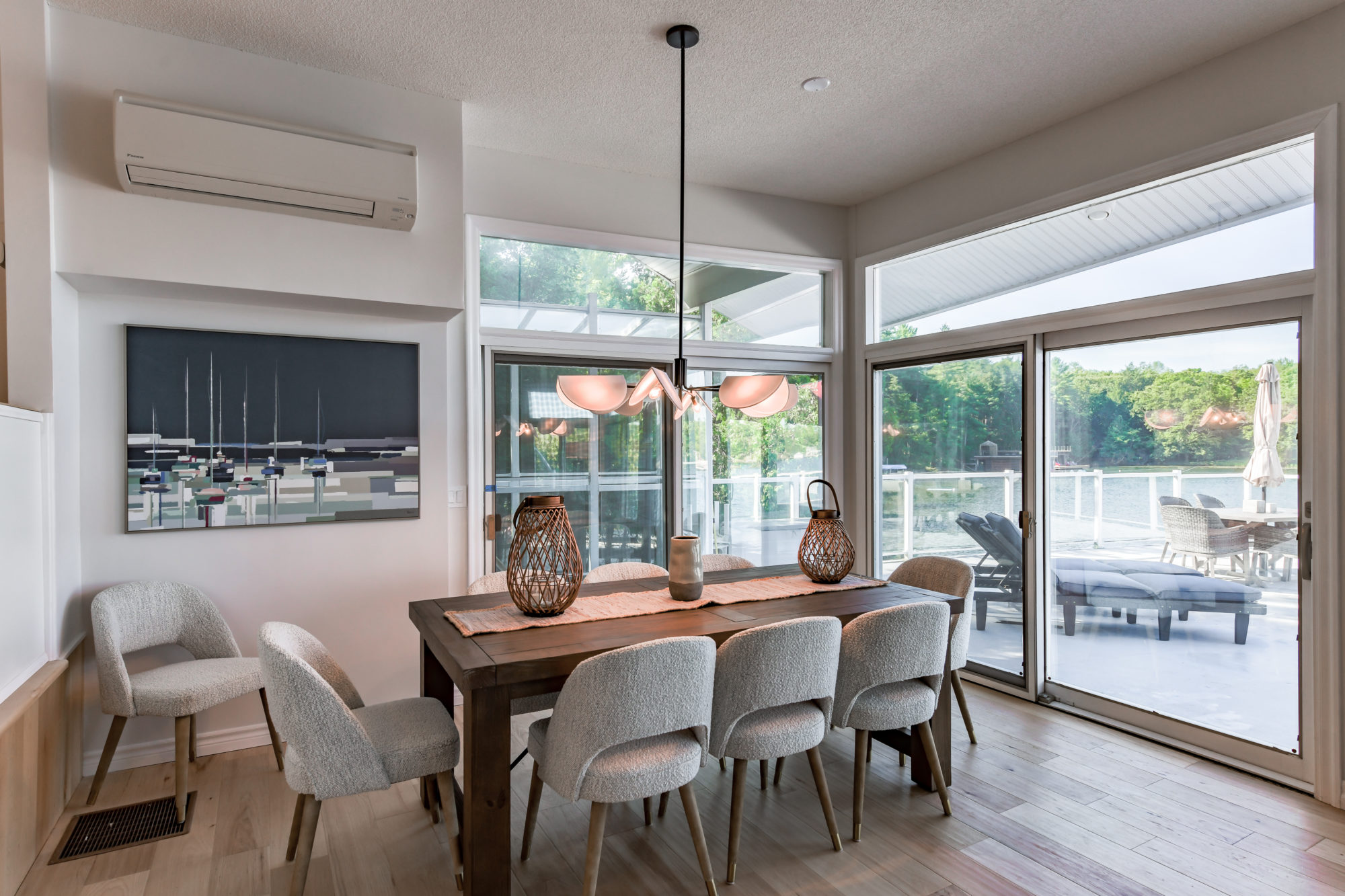 Two sets of sliding glass doors illuminate the space. 