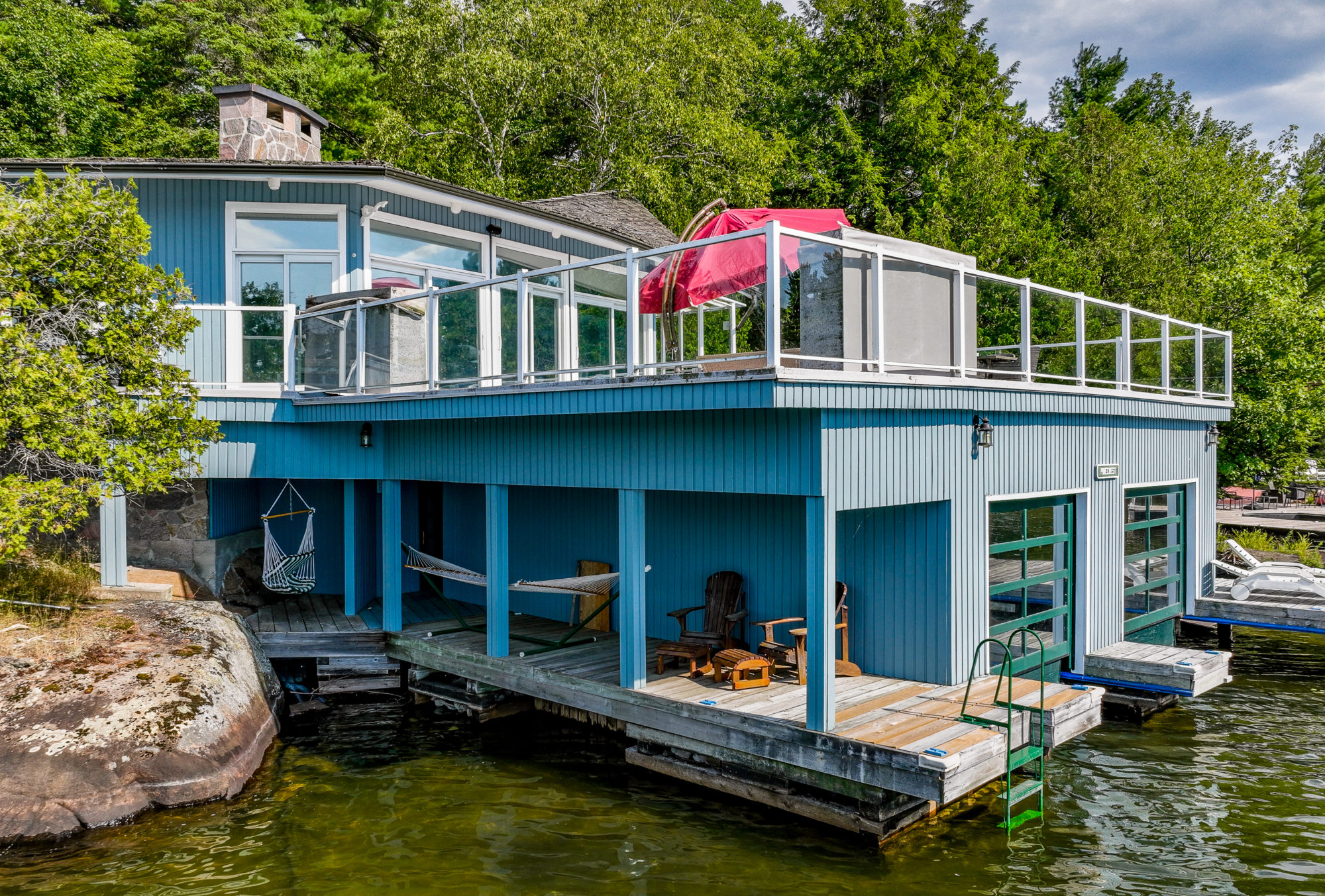 The boathouse stands above five-foot-deep water. 