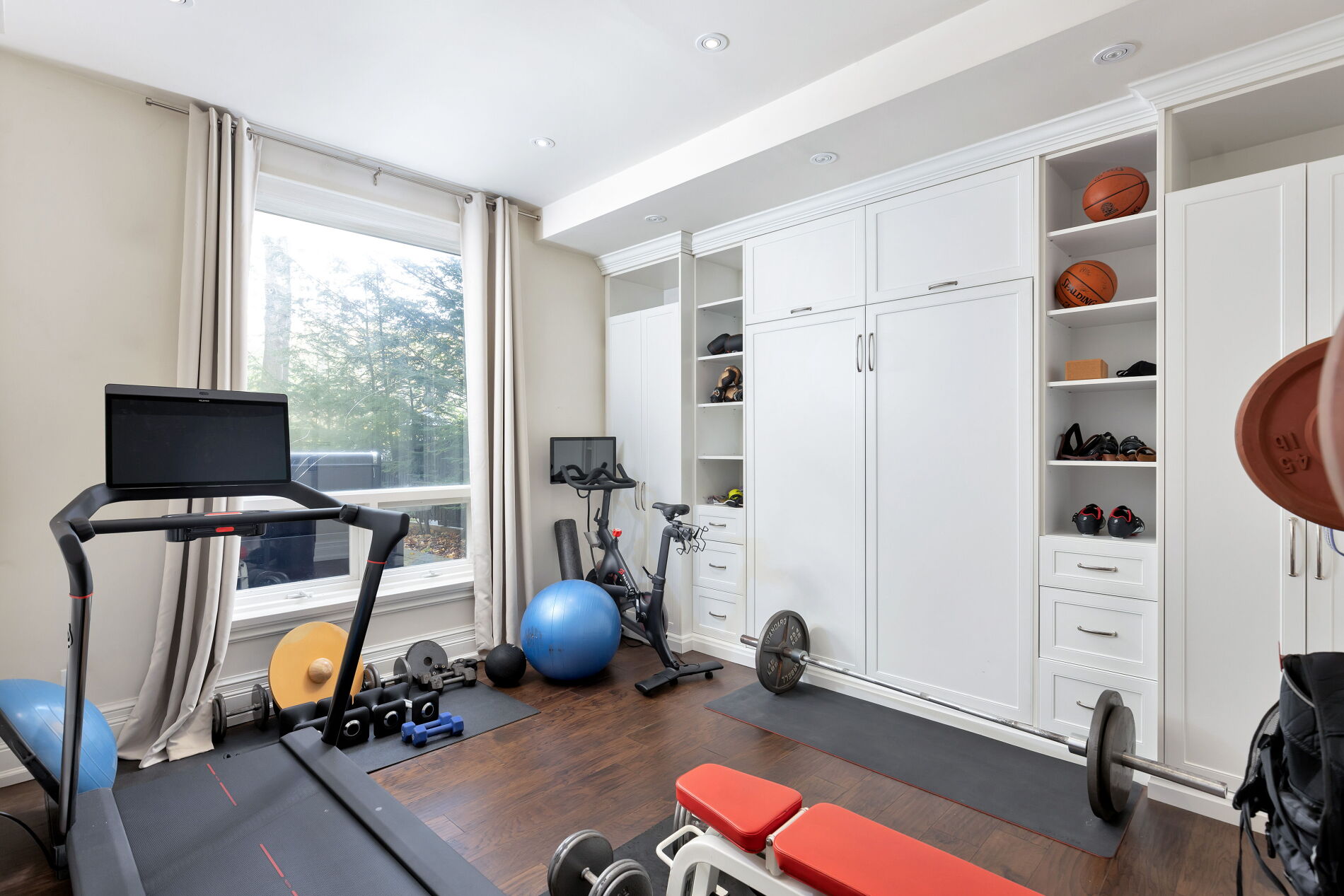 The fitness room is right next to the lower-level kitchen. 