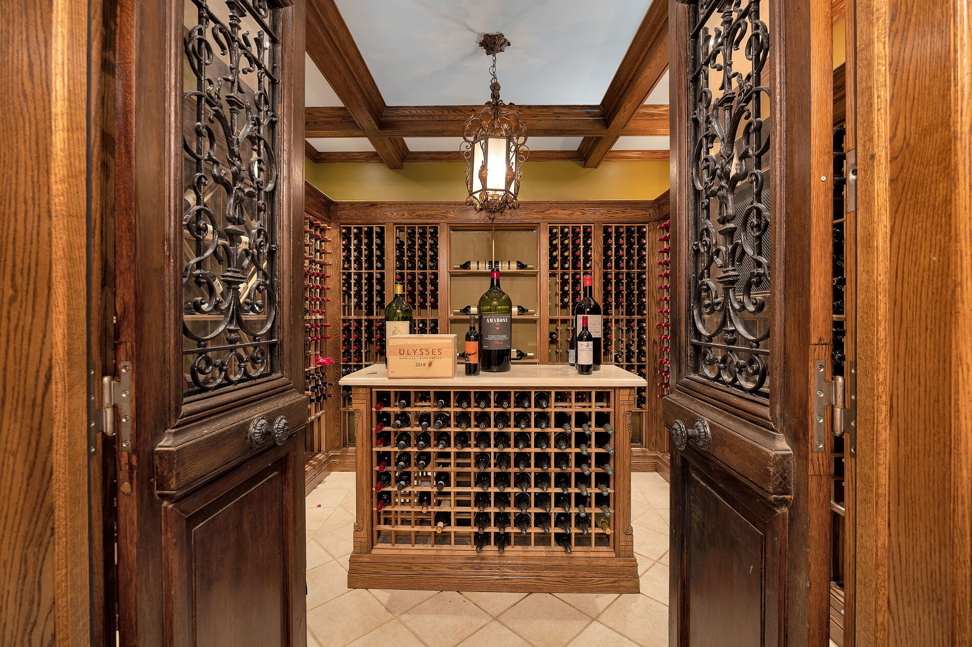 The wine cellar is climate controlled and comes with coffered ceilings. 