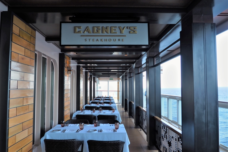 Window seat tables at Cagney's Steakhouse on Norwegian Bliss cruise ship, Mexican Riviera cruise from Los Angeles