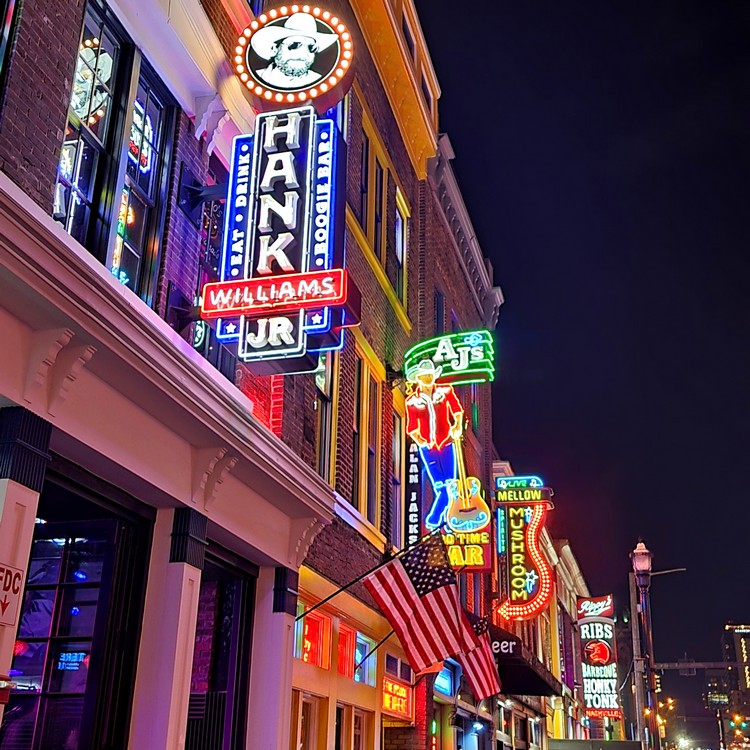 Neon signs light up Broadway Street in Nashville at night