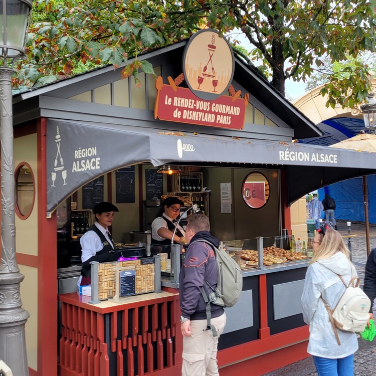 Vendors selling French cuisine at Remy's Ratatouille Adventure in Disneyland Park at Disneyland Paris