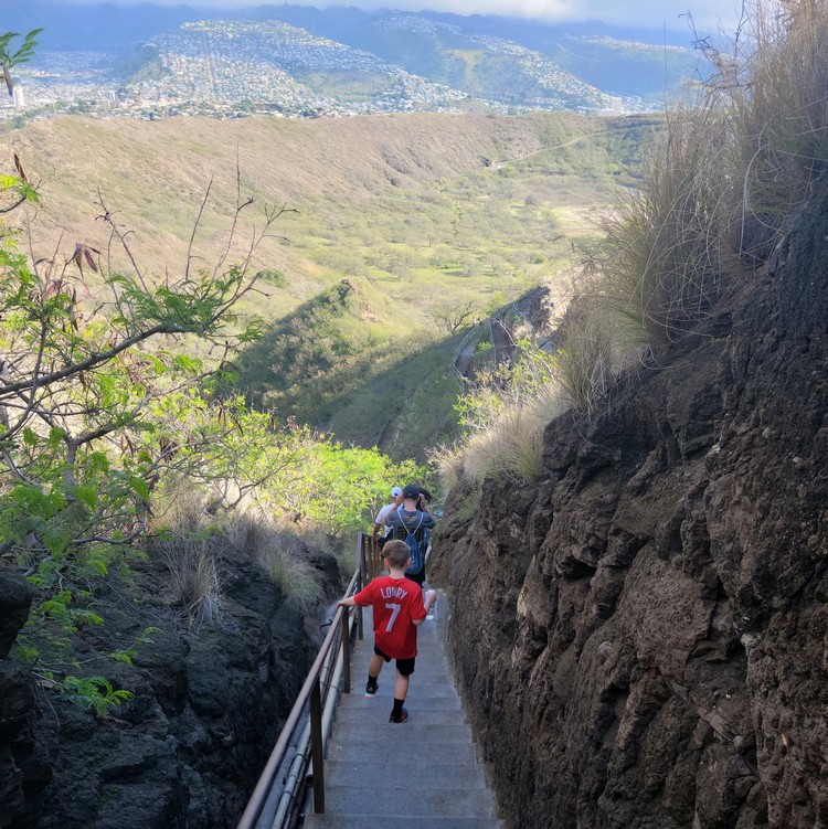 walking down the stairs on Diamond Head Hike trail 