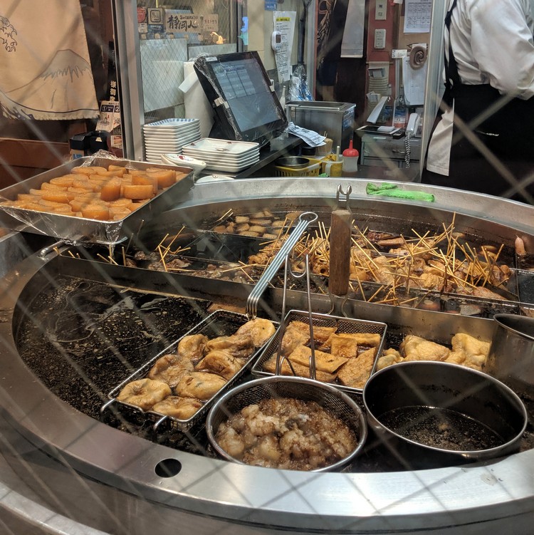 Interesting Japanese food, Takoyaki street food vendor near Fushimi Inari temple in Kyoto