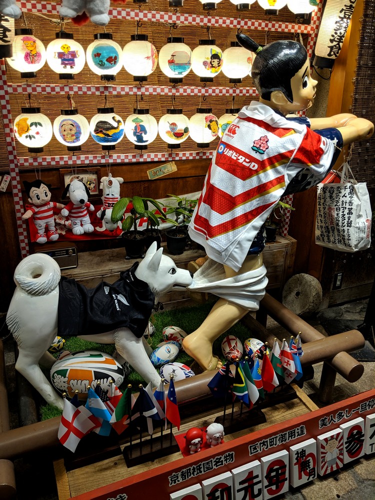 funny statue of boy with pants down at restaurant in Gion Kyoto. Okonomiyaki restaurant with boy statue in Kyoto