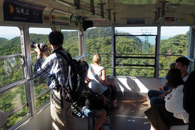 Kobe travel - Traveling down from Mount Rokko inside the tram on the Rokko-Arima Ropeway towards Arima Onsen Hot Springs