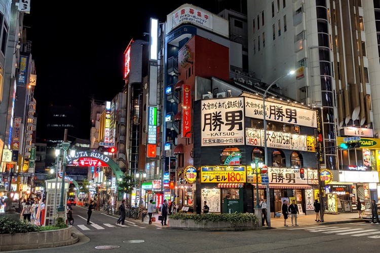 street in Kobe Japan will lots of neon signs and lights