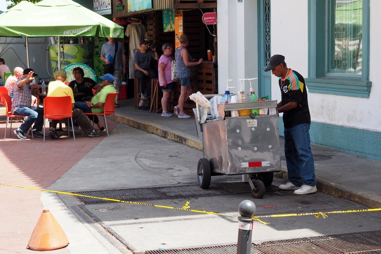 Street vendor selling shaved ice to tourists in Casco Veijo. This is a popular drink/dessert in Panama.