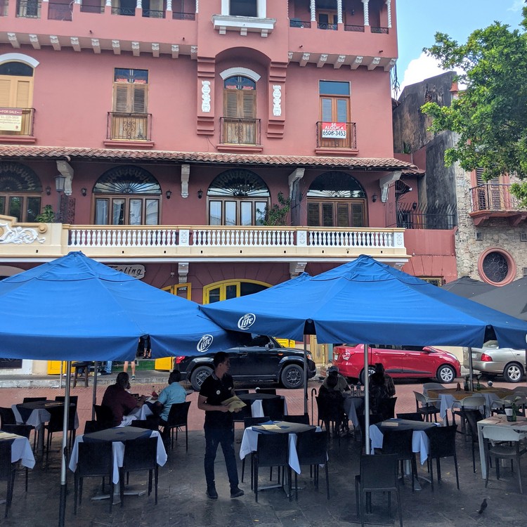 Outdoor patio restaurant at Plaza Simón Bolívar square in Casco Viejo Old Quarter of Panama City, Panama