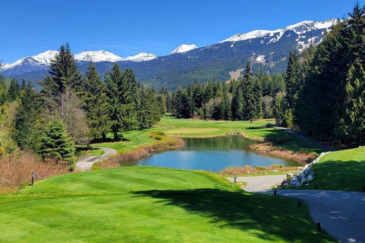 whistler village golf course greens with mountain views in the backdrop